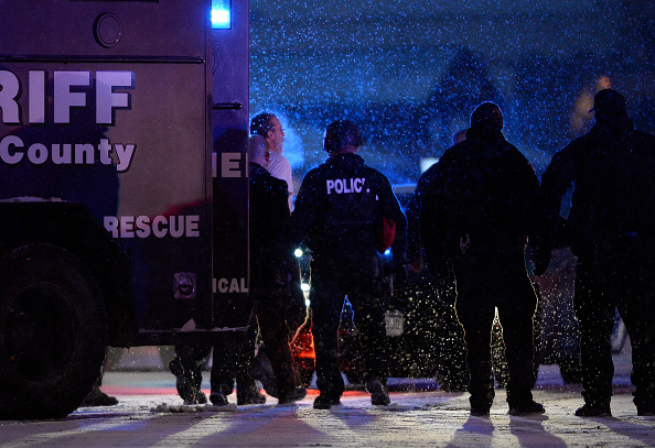 Police take Robert Lewis Dear into custody after a mass shooting at a Colorado Springs Planned Parenthood.